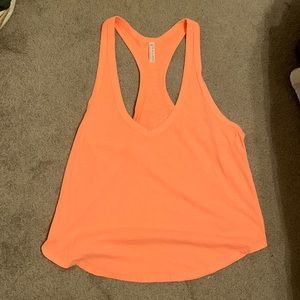 Free People Movement loose fitting neon orange workout tank